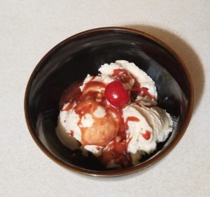 bowl of ice cream with cherry mash honey butter